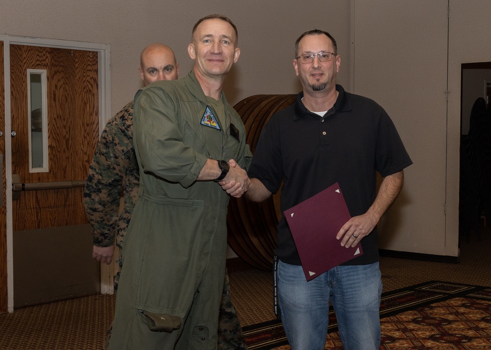 Col. Jared K. Stone presents awards to civilian employees