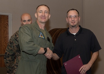 Col. Jared K. Stone presents awards to civilian employees