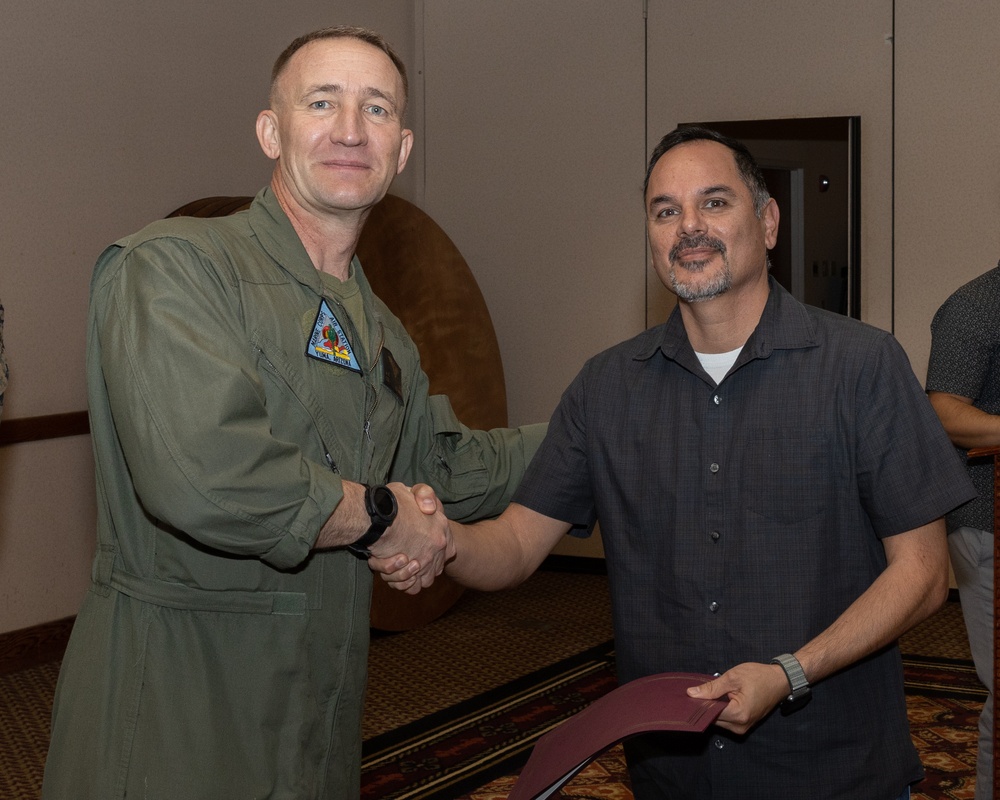 Col. Jared K. Stone presents awards to civilian employees