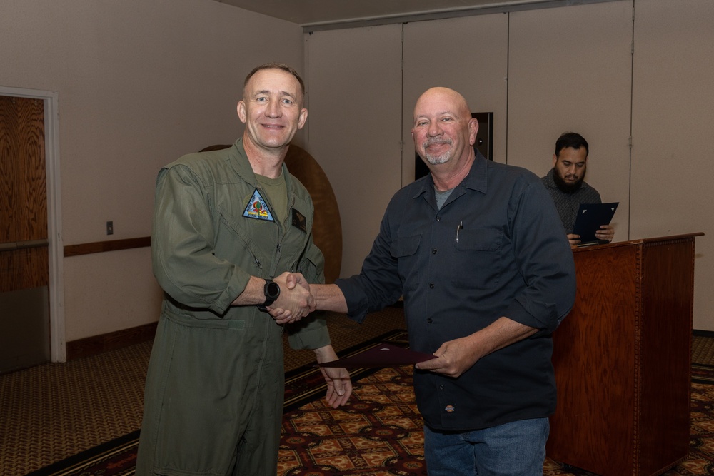 Col. Jared K. Stone presents awards to civilian employees