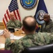 Vice Adm. Scott Gray, commander, Navy Installations Command, left, meets with Rear Adm. Steve Barnett, commander, Navy Closure Task Force - Red Hill, right, and Rear Adm.