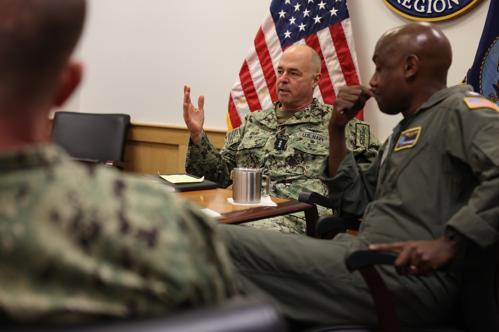 Vice Adm. Scott Gray, commander, Navy Installations Command, center, meets with Rear Adm. Steve Barnett, commander, Navy Closure Task Force - Red Hill