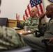 Vice Adm. Scott Gray, commander, Navy Installations Command, center, meets with Rear Adm. Steve Barnett, commander, Navy Closure Task Force - Red Hill
