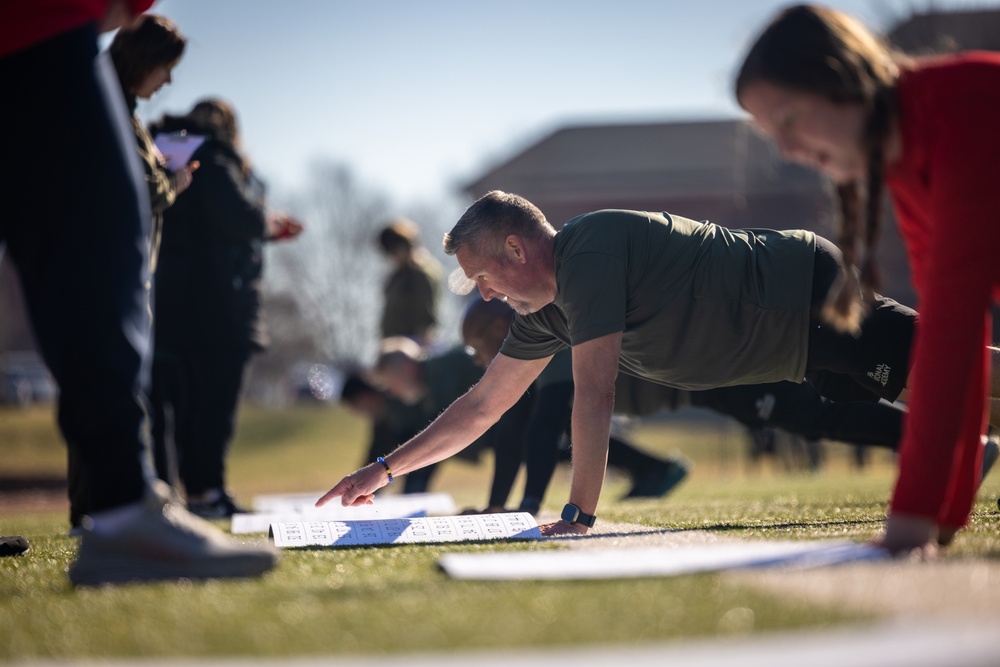 U.S. Marines with the Wounded Warrior Regiment and students with the Federal Bureau of Investigation National Academy participate in an annual joint physical training
