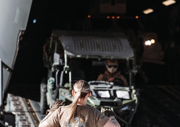 Marines with 3rd LAR unload tactical vehicles off of Air Force C-17 Globemaster III cargo aircraft
