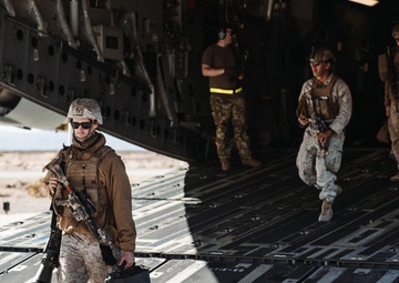 Marines with 3rd LAR unload tactical vehicles off of Air Force C-17 Globemaster III cargo aircraft