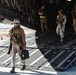 Marines with 3rd LAR unload tactical vehicles off of Air Force C-17 Globemaster III cargo aircraft
