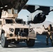 Marines with 3rd LAR unload tactical vehicles off of Air Force C-17 Globemaster III cargo aircraft