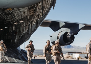 Marines with 3rd LAR unload tactical vehicles off of Air Force C-17 Globemaster III cargo aircraft