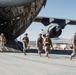 Marines with 3rd LAR unload tactical vehicles off of Air Force C-17 Globemaster III cargo aircraft