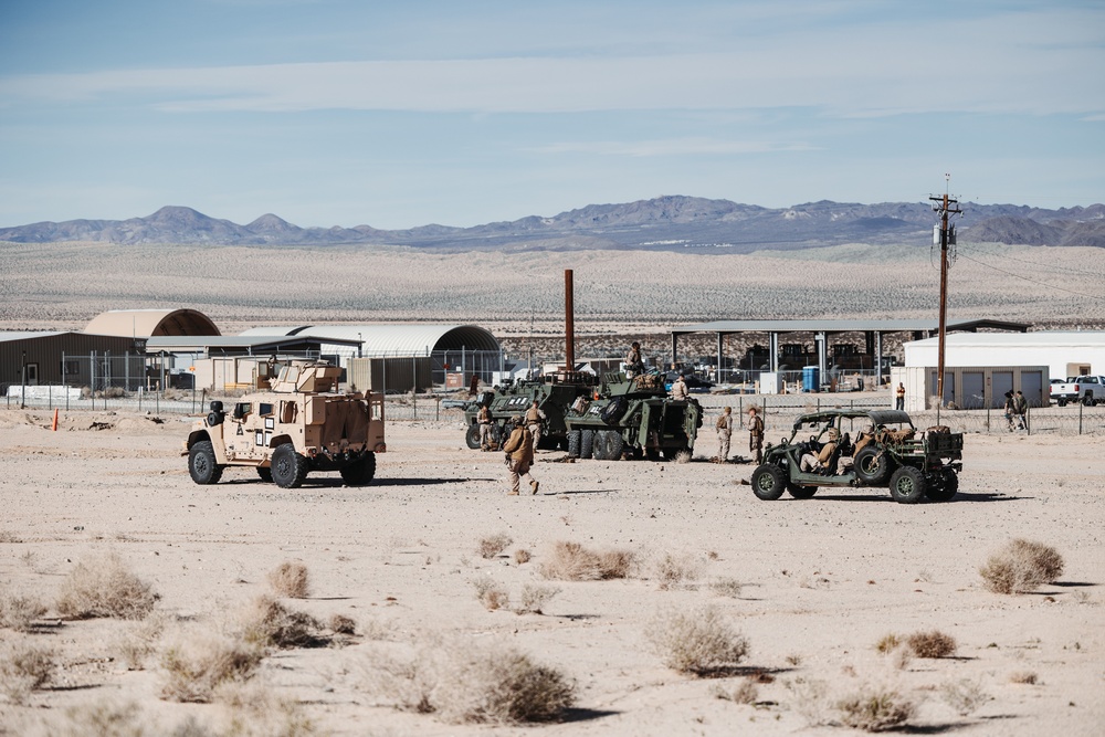 Marines with 3rd LAR unload tactical vehicles off of Air Force C-17 Globemaster III cargo aircraft