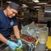 USS Ronald Reagan (CVN 76) Sailors prepare food in the aft galley