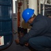 USS Ronald Reagan (CVN 76) Sailors troubleshoot a quick-acting water tight door