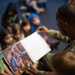 86 AW commander reads to RAB children