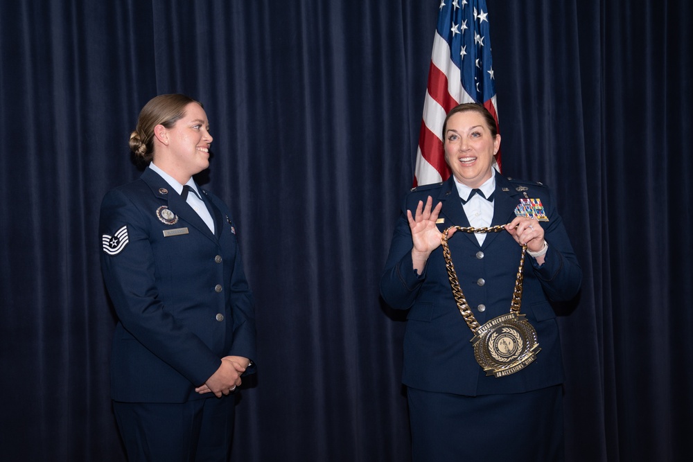 Tech. Sgt. Kristina Bloodgood presented with medallion during ceremony at Nevada Air National Guard Base in Reno, Nev.