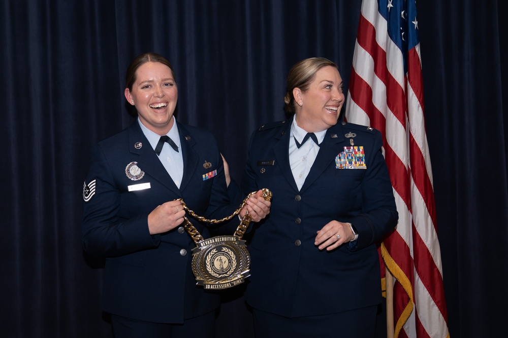 Tech. Sgt. Kristina Bloodgood is presented a medallion during a ceremony at Nevada Air National Guard Base in Reno, Nev.
