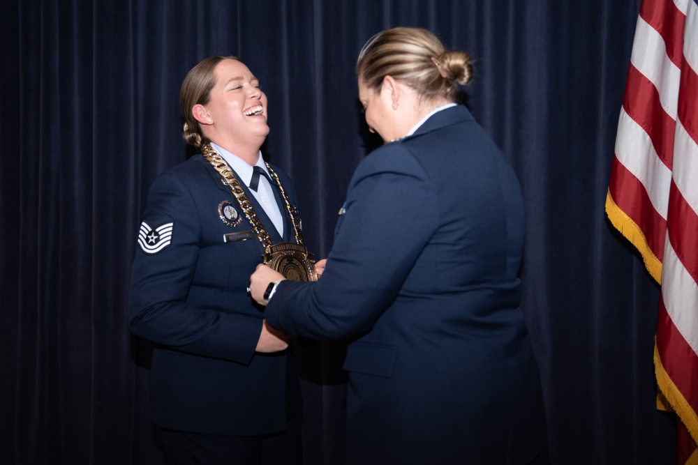 Tech. Sgt. Kristina Bloodgood is presented a medallion during a ceremony at Nevada Air National Guard Base in Reno, Nev.