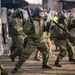 Advancing on Rioters