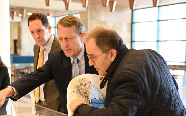 USAID ME SDAA Andrew Plitt, AUC President Ahmad Dallal, and USAID Egypt Mission Director Sean Jones examine an architectural model of AUC campus, February 5, 2024.