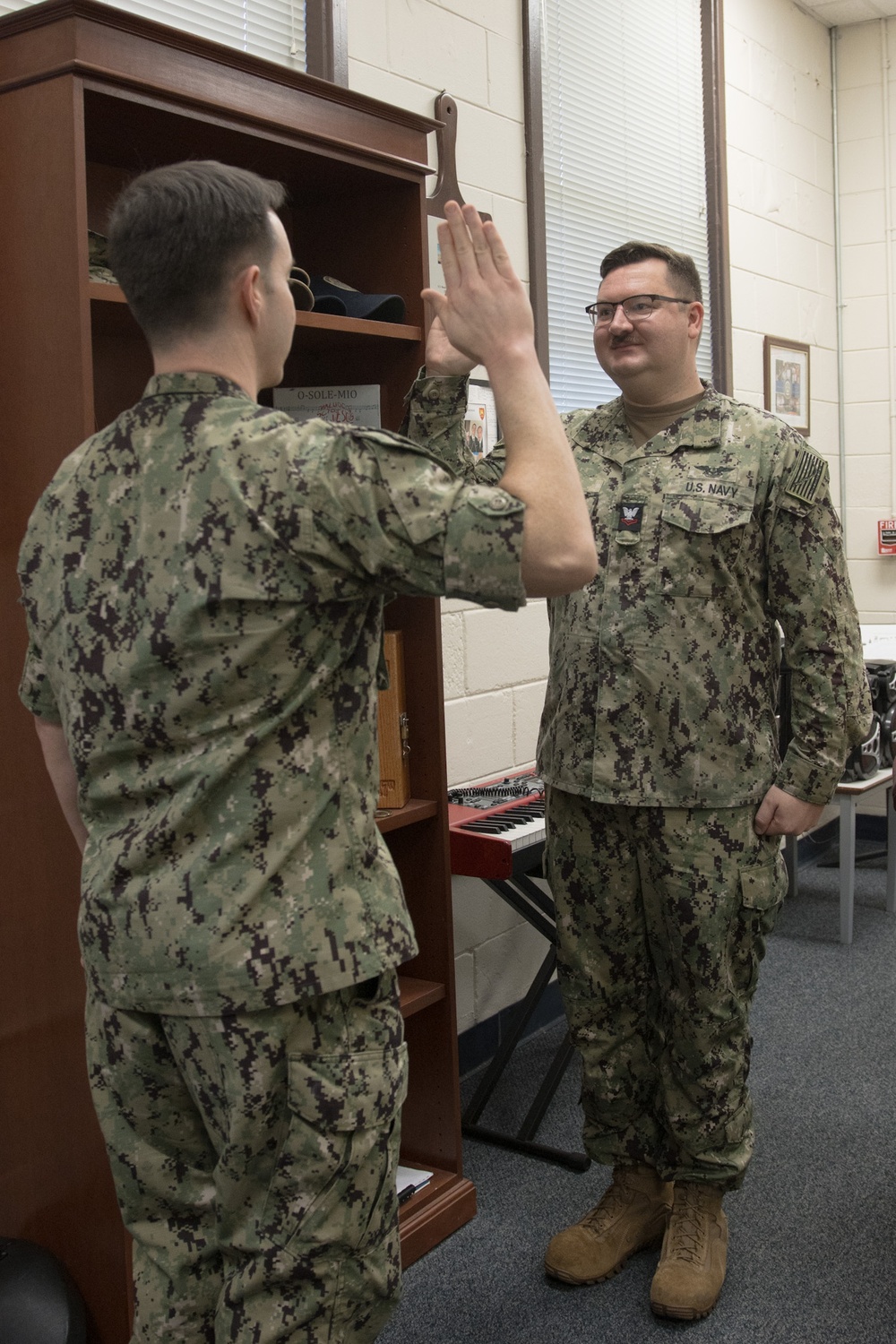 Lieutenant Nicholas Nadal Reenlists Musician 2nd Class Adam Byars