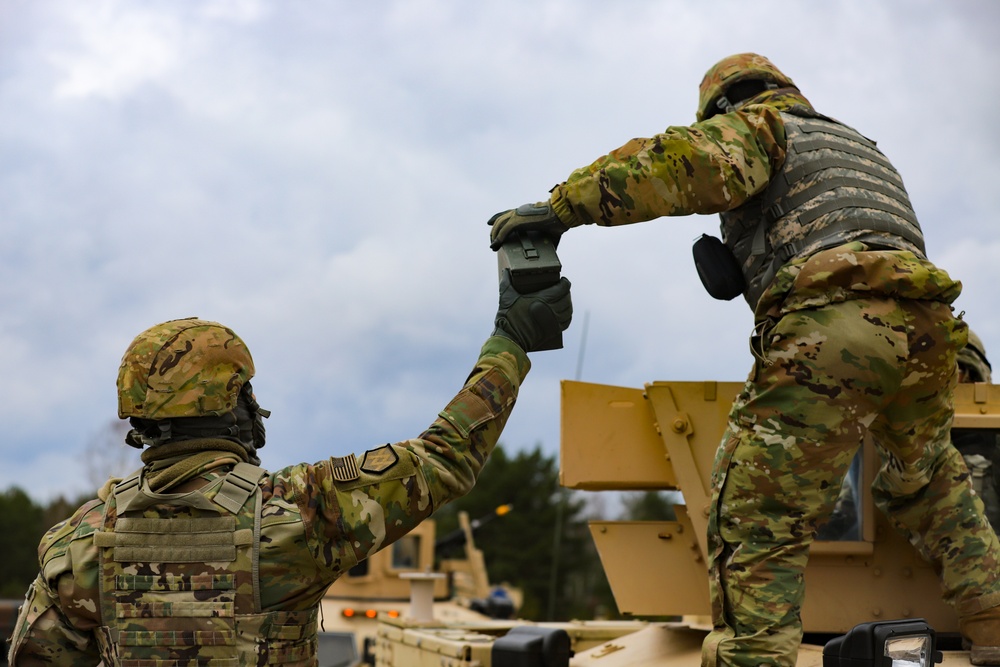 Task Force Provider Soldiers execute a convoy live fire exercise