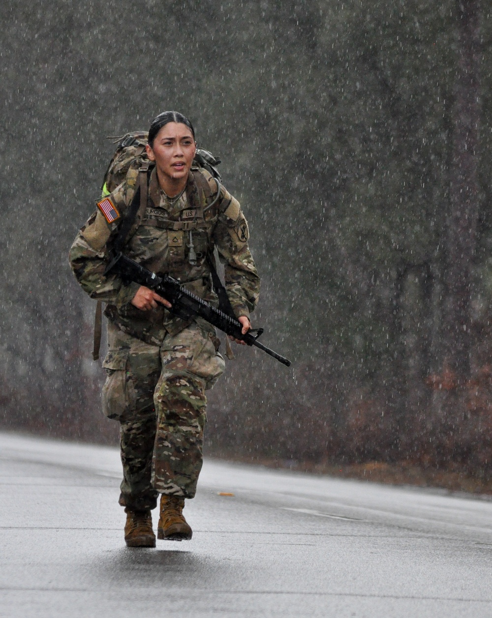 CA soldiers rucks through rainstorm during squad competition