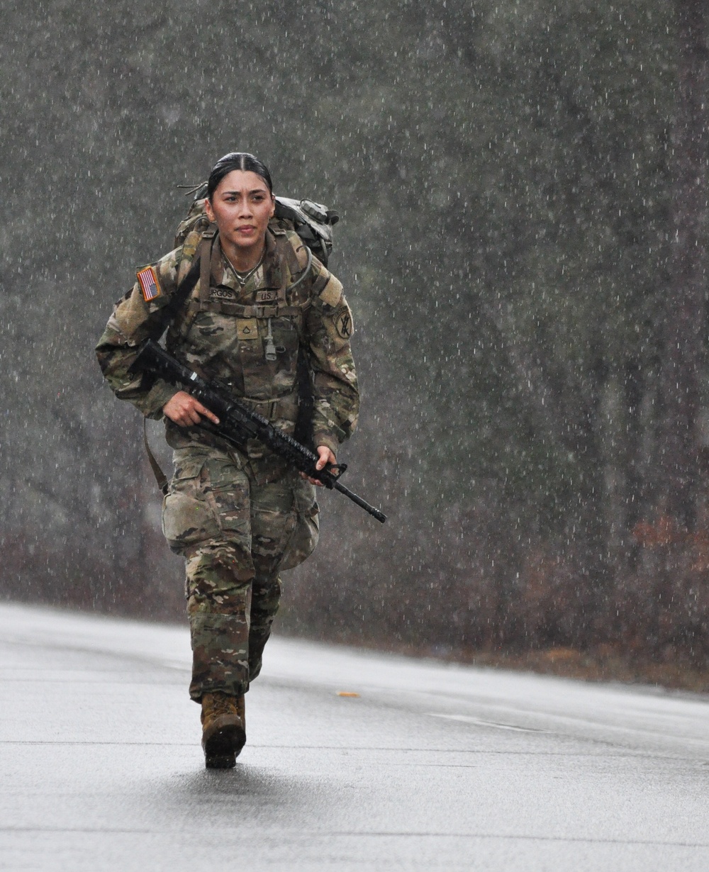 Civil Affairs trooper nears the end of a rainy 12-mile ruck march