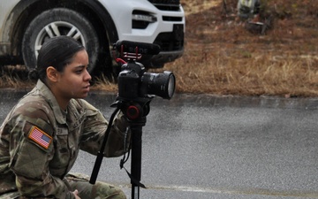 Public Affairs NCO challenges rain, cold to capture ruck march finishers in squad competition