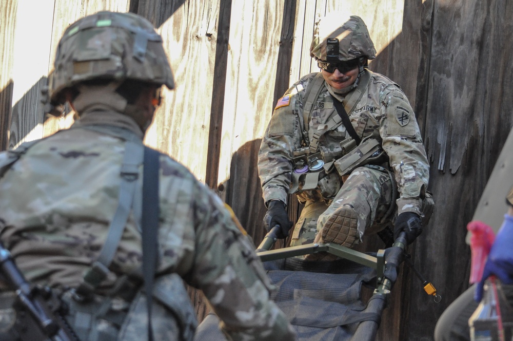 Civil Affairs Soldier readies stretcher for casualty evacuation during a training exercise