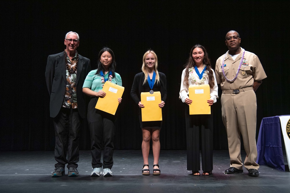 Pacific Missile Range Facility (PMRF) Presents the Naval Science Award to  Students at the Kauai Regional Science and Engineering Fair.