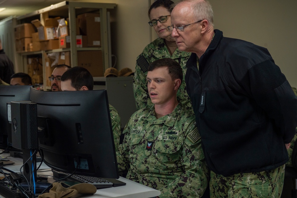 Adm. Daryl Caudle observes final testing of NMRO system at NIWC Atlantic performed by USS Mitscher Sailors.