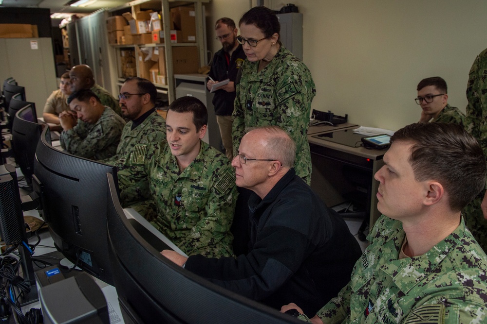 Adm. Daryl Caudle observes final testing of NMRO system at NIWC Atlantic performed by USS Mitscher Sailors.