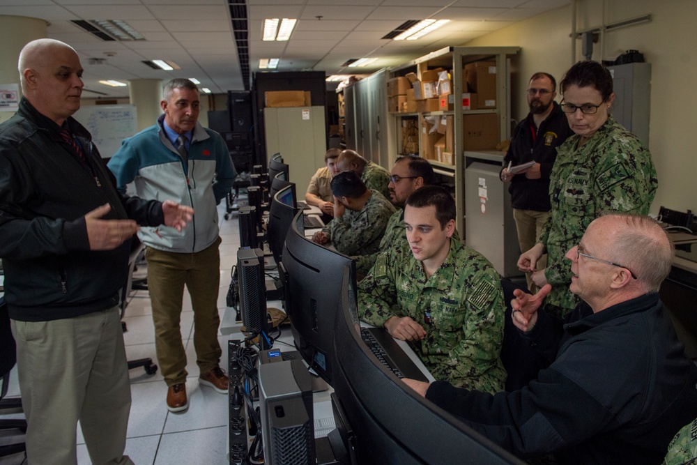 Adm. Daryl Caudle observes final testing of NMRO system at NIWC Atlantic performed by USS Mitscher Sailors.
