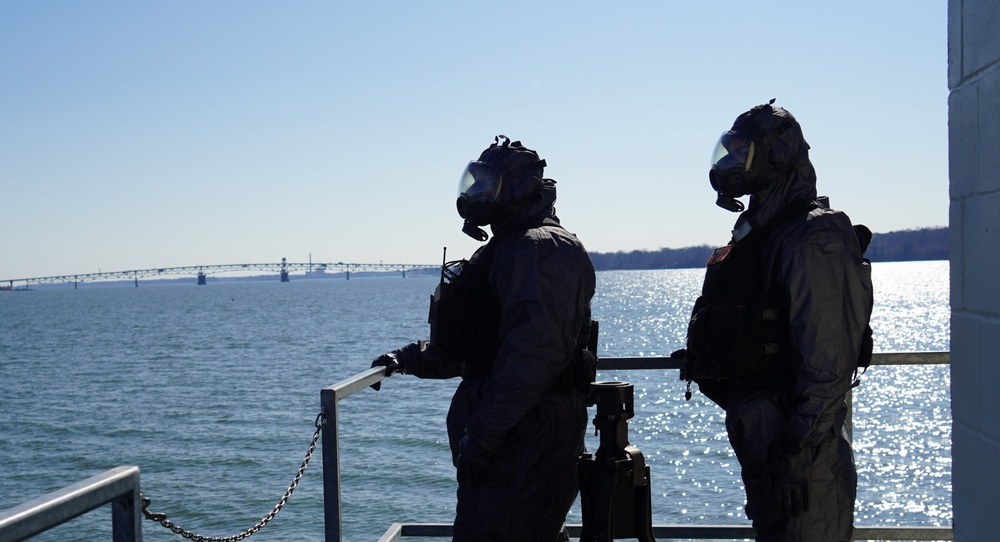 NWS Sailors keep watch during Exercise Citadel Shield-Solid Curtain 2024 while wearing chemical suits