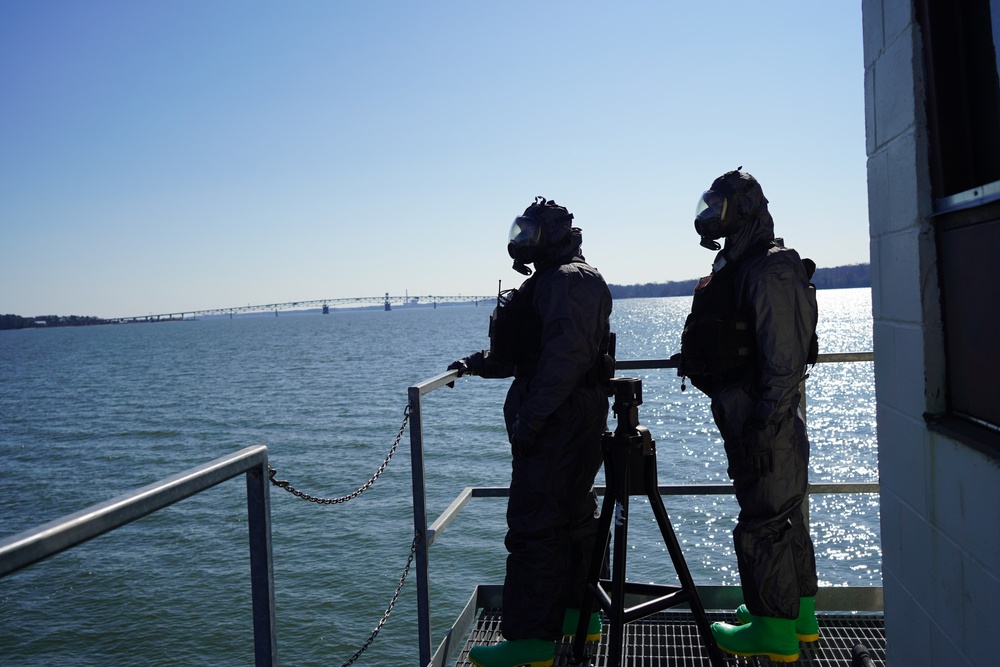 NWS Sailors keep watch during Exercise Citadel Shield-Solid Curtain 2024 while wearing chemical suits