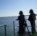 NWS Sailors keep watch during Exercise Citadel Shield-Solid Curtain 2024 while wearing chemical suits