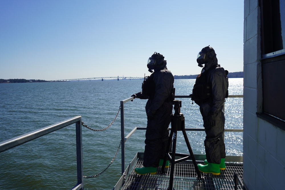 NWS Sailors keep watch during Exercise Citadel Shield-Solid Curtain 2024 while wearing chemical suits