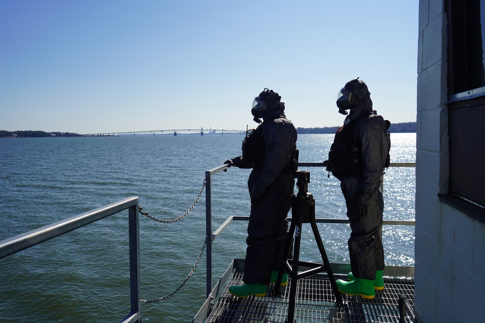 NWS Sailors keep watch during Exercise Citadel Shield-Solid Curtain 2024 while wearing chemical suits