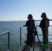 NWS Sailors keep watch during Exercise Citadel Shield-Solid Curtain 2024 while wearing chemical suits