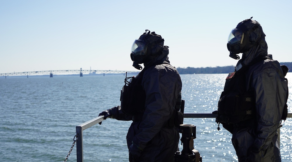 NWS Sailors keep watch during Exercise Citadel Shield-Solid Curtain 2024 while wearing chemical suits