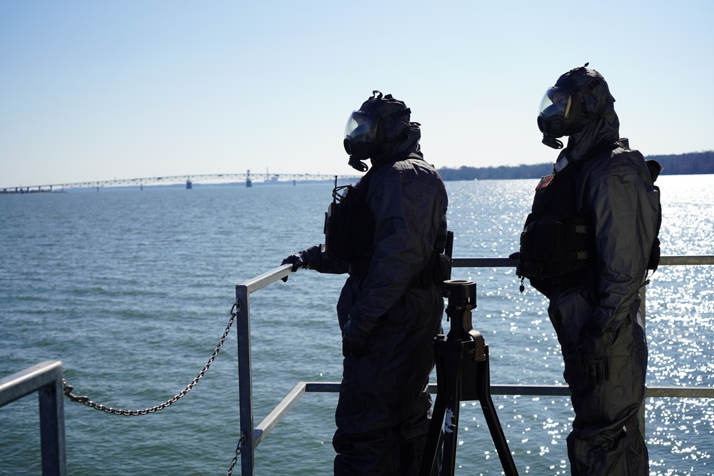 NWS Sailors keep watch during Exercise Citadel Shield-Solid Curtain 2024 while wearing chemical suits