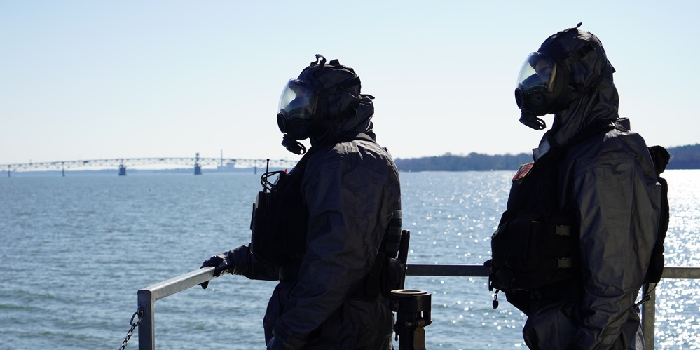 NWS Sailors keep watch during Exercise Citadel Shield-Solid Curtain 2024 while wearing chemical suits