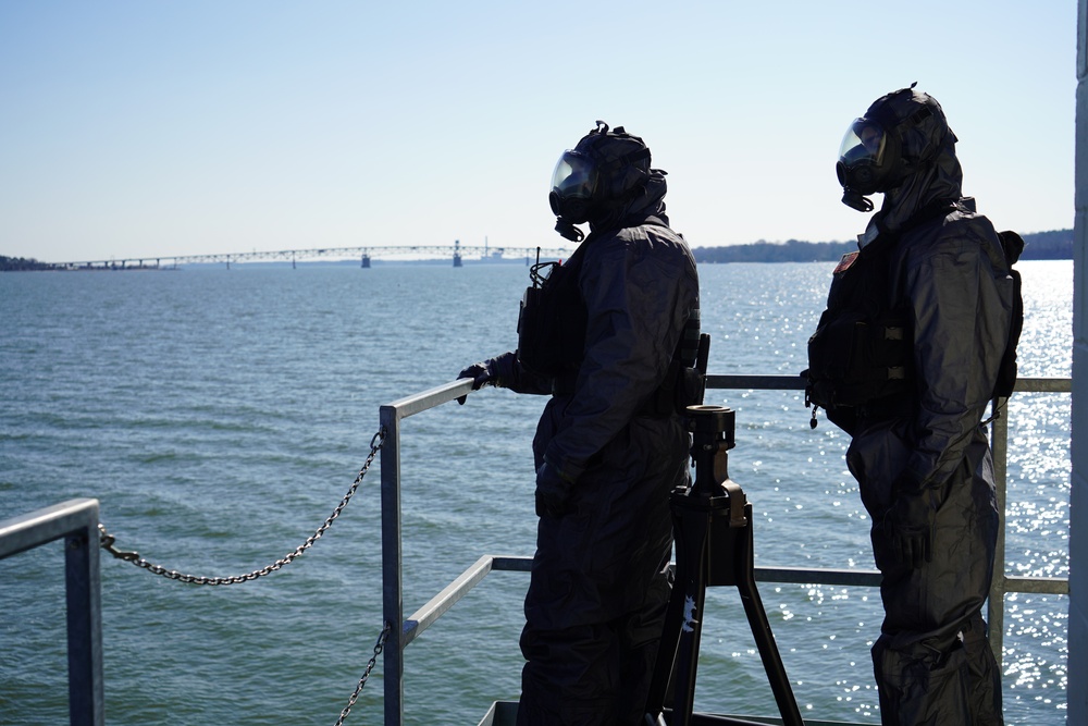 NWS Sailors keep watch during Exercise Citadel Shield-Solid Curtain 2024 while wearing chemical suits