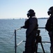 NWS Sailors keep watch during Exercise Citadel Shield-Solid Curtain 2024 while wearing chemical suits