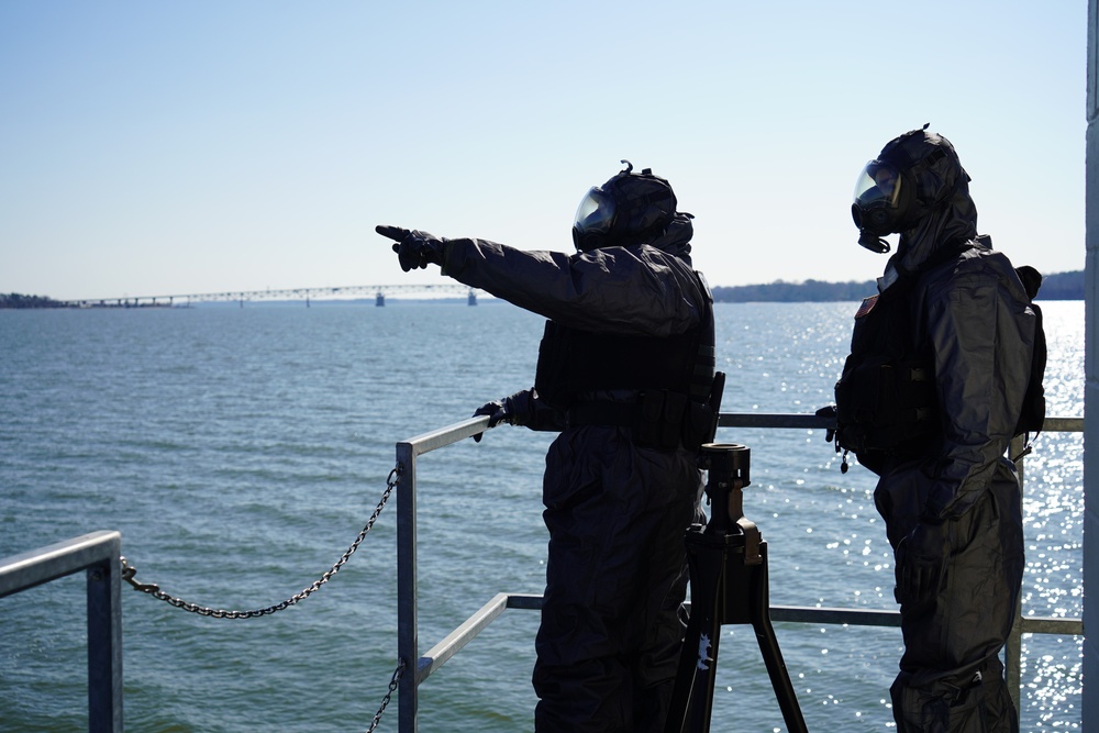 NWS Sailors keep watch during Exercise Citadel Shield-Solid Curtain 2024 while wearing chemical suits