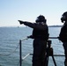 NWS Sailors keep watch during Exercise Citadel Shield-Solid Curtain 2024 while wearing chemical suits