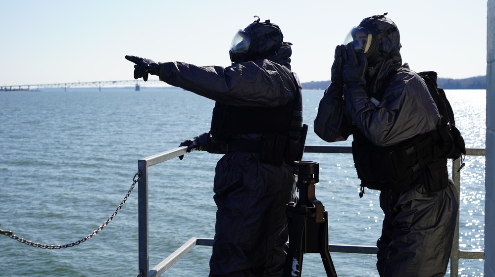 NWS Sailors keep watch during Exercise Citadel Shield-Solid Curtain 2024 while wearing chemical suits