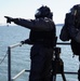 NWS Sailors keep watch during Exercise Citadel Shield-Solid Curtain 2024 while wearing chemical suits