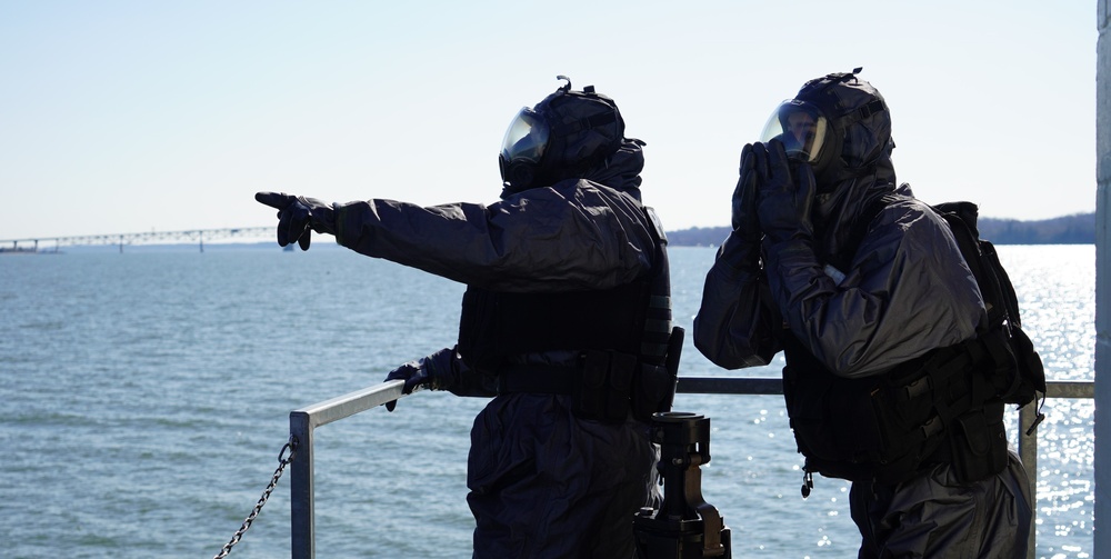 NWS Sailors keep watch during Exercise Citadel Shield-Solid Curtain 2024 while wearing chemical suits