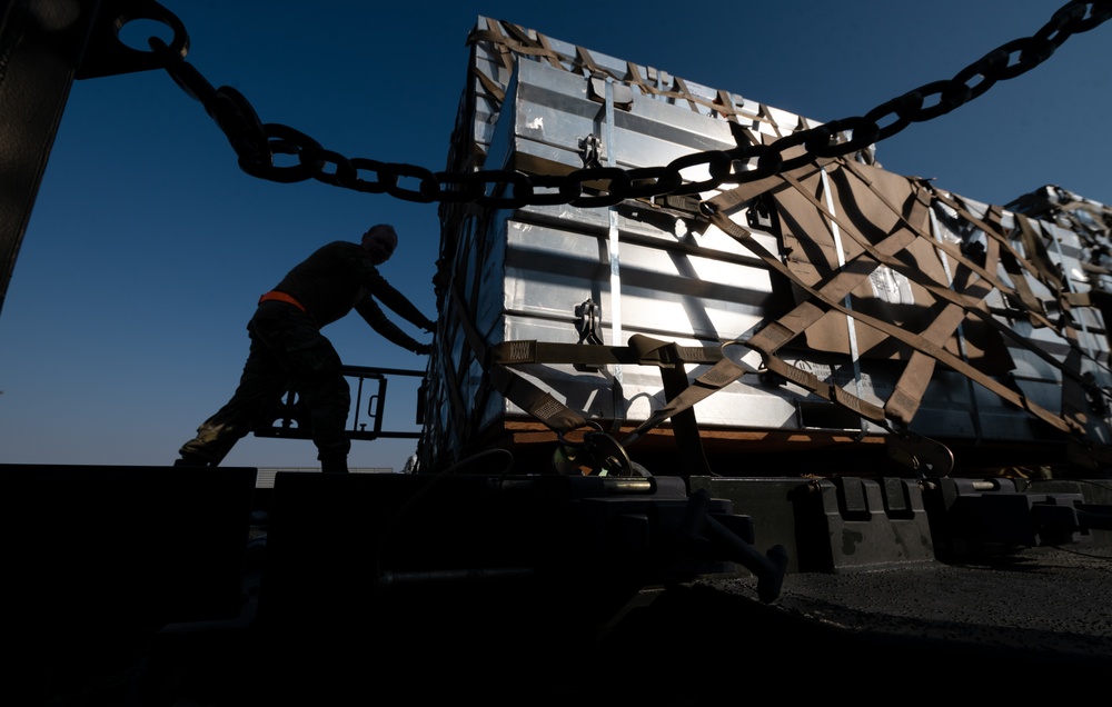 Airmen load cargo on C-17 Globemaster III